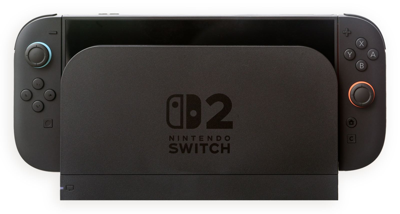 A Nintendo Switch 2 console sitting in its black dock with the Joy-Con 2 controllers attached on each side