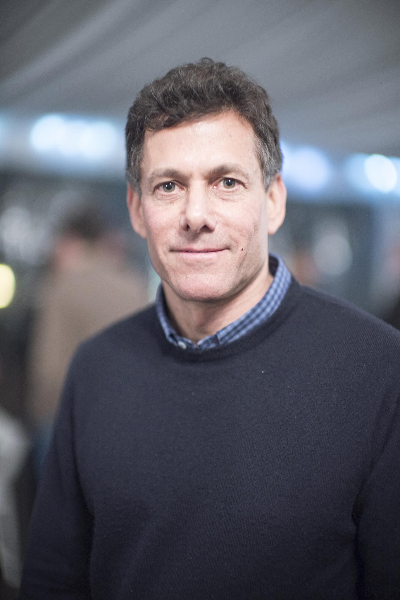 Portrait of Take-Two chief executive Strauss Zelnick in a dark sweater and collared shirt